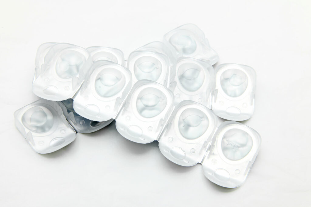 What Happens If You Sleep in Contacts? 2 stack of disposal contact lense isolated on white