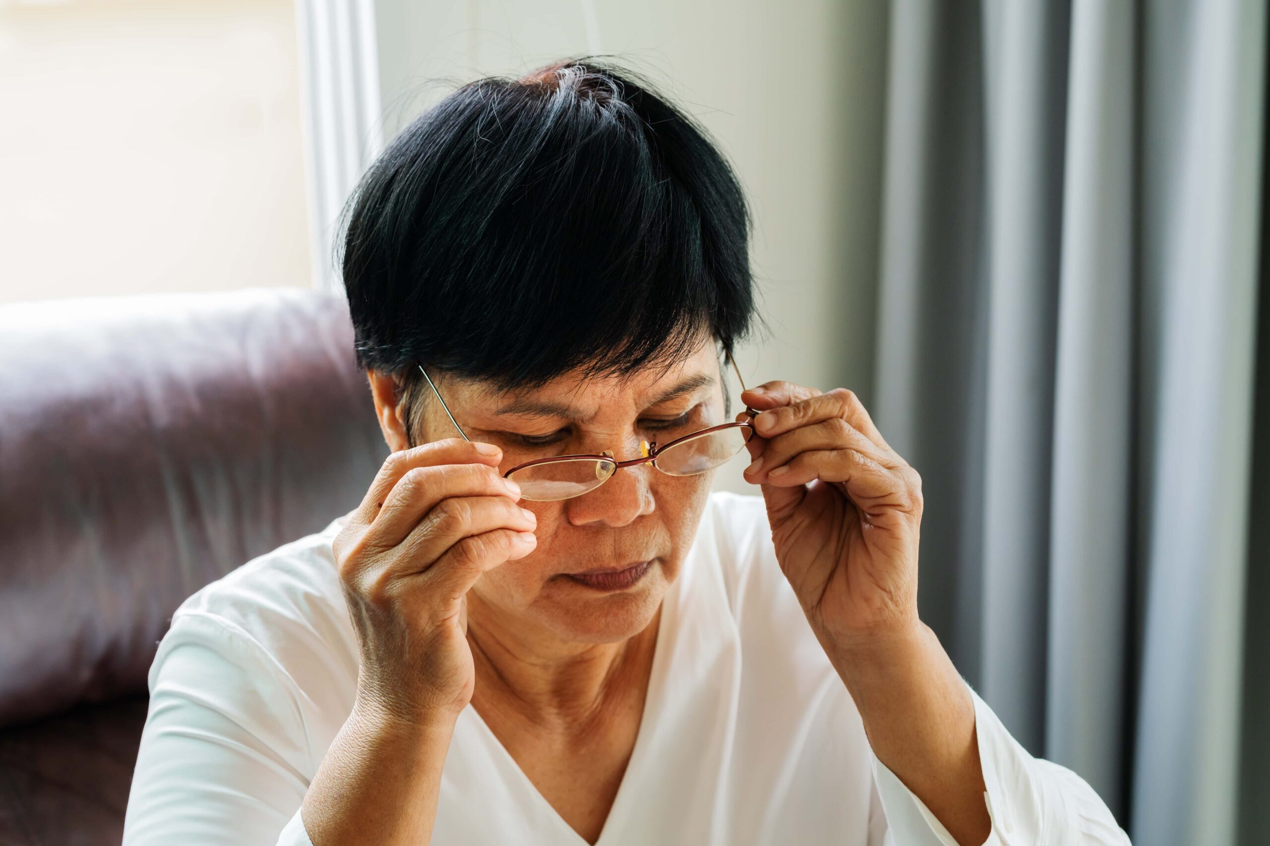 What Are Reading Glasses? 9 mature asian woman wearing her eyeglasses edited scaled