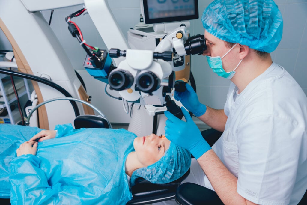What is LASIK Enhancement? 2 Patient under surgical microscope for vision correction