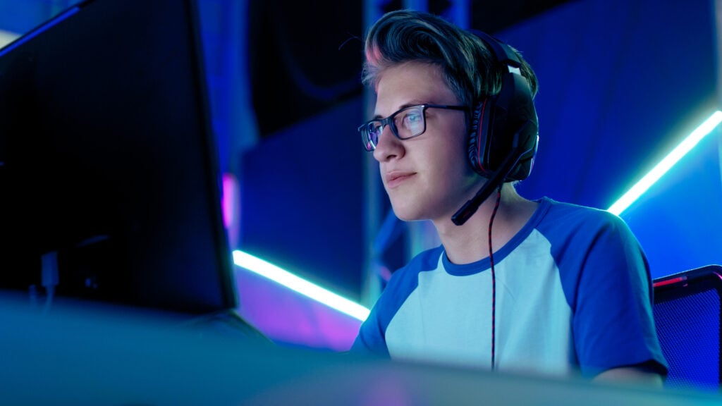 What Are Gaming Glasses and How Do They Work? 5 Teenage Boy Gamer Plays in Competitive Video Game on an egames competition