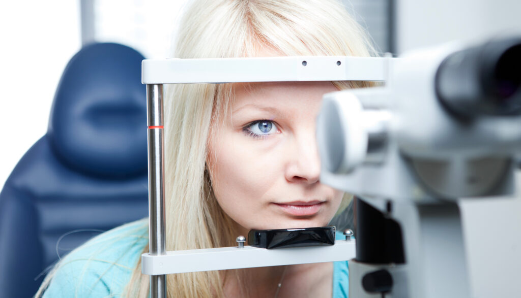 Where to Find Cheap Eye Exams 2 Young blonde woman getting her eye checked by optometrist